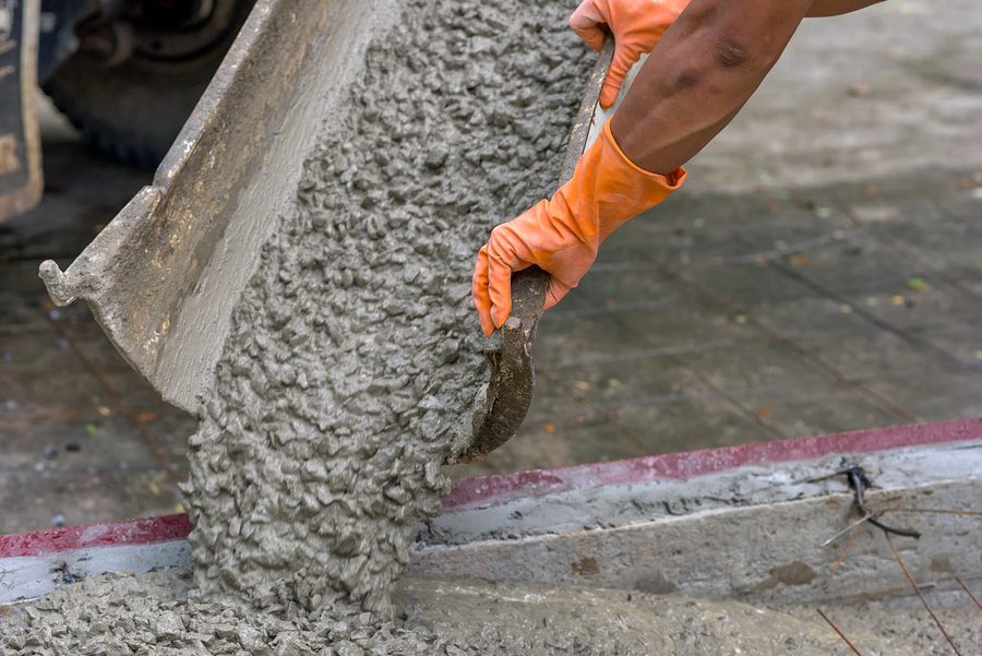 man holding a mixed cement