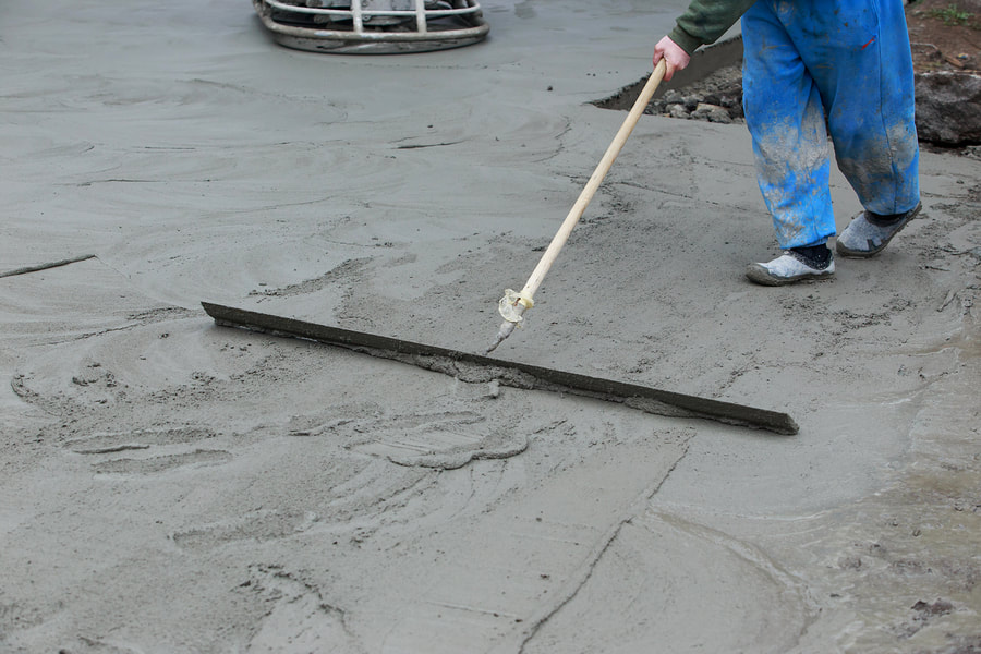 men flatting the cement